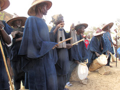 During the Dogon Mask Dance, it is the elders (men only ) who make the rythme