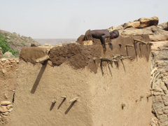 Dogon houses require occasional maintenance work