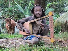 A young Kaffa boy with a harp