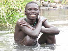 Bartu loves to bathe in his village's river.