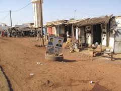 For those who can't read, signs are often made with pictures as well as with words : as you can see here this is a barber shop and a mobile phone shop.