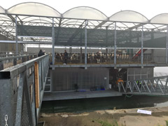 The Floating Farm of Rotterdam is a two-story building, with the lower floor used for bottling milk and as a cheese factory.