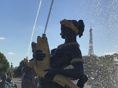 A fountain in the middle of the Place de la Concorde.